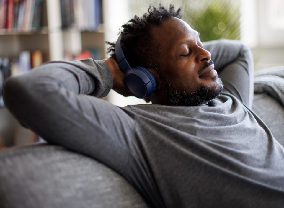 Man relaxing while listening to headphones