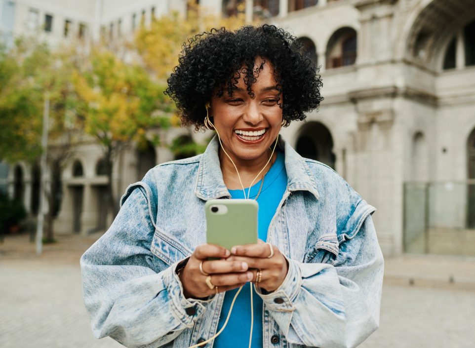 Woman holding a phone with a minimal mint green case